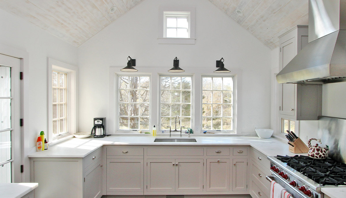 White Pella replacement windows in farmhouse kitchen